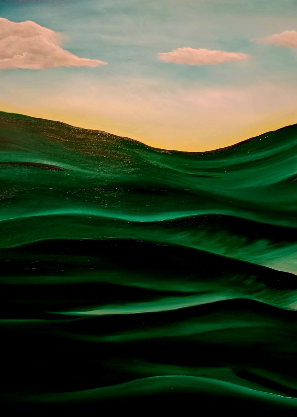 Green rolling hills under a pink sky