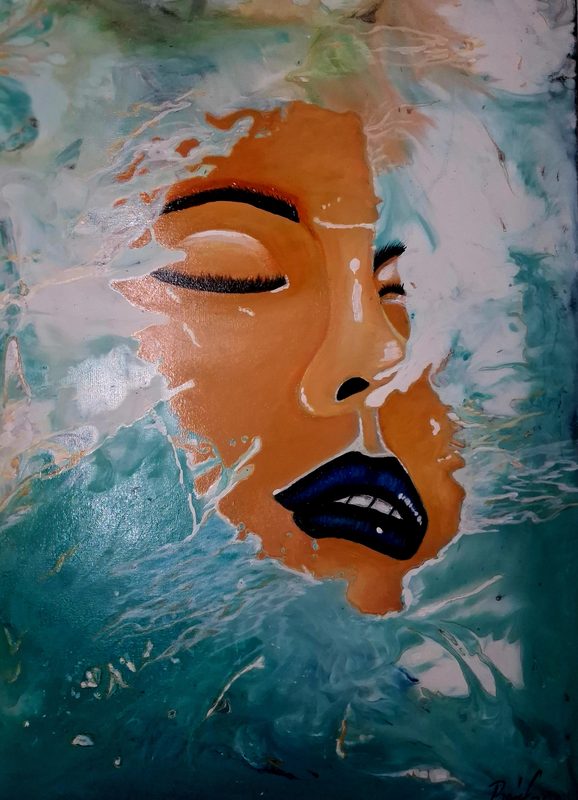 Espuma del Mar – a woman’s face with closed eyes surrounded by turquoise sea foam